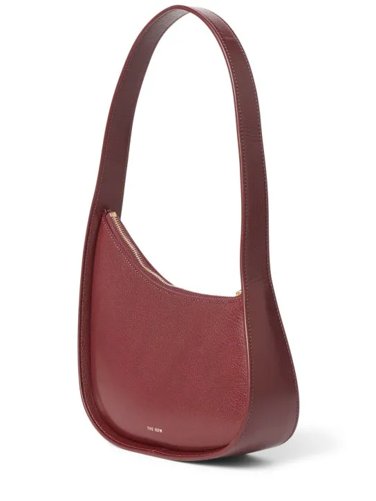 The Row   Half Moon shiny leather shoulder bag 